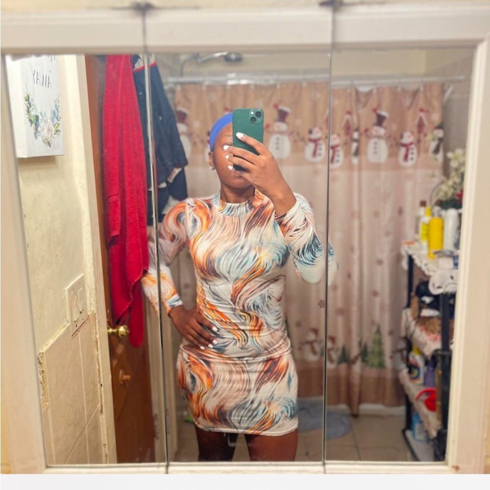 Mini multi-color dress from Fashion Nova. 
Soft Fabric and snatches your body!